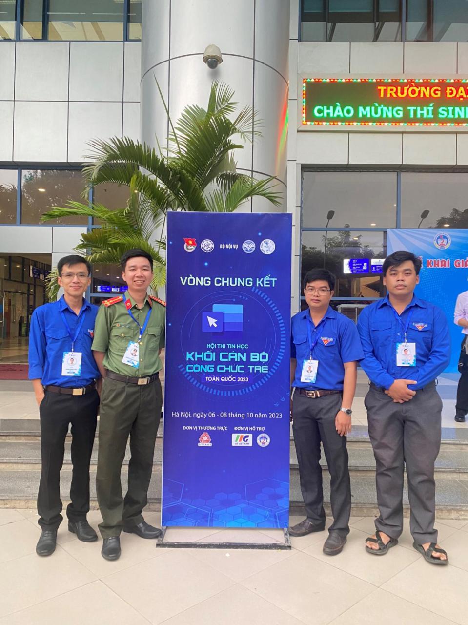 A group of men standing in front of a building

Description automatically generated