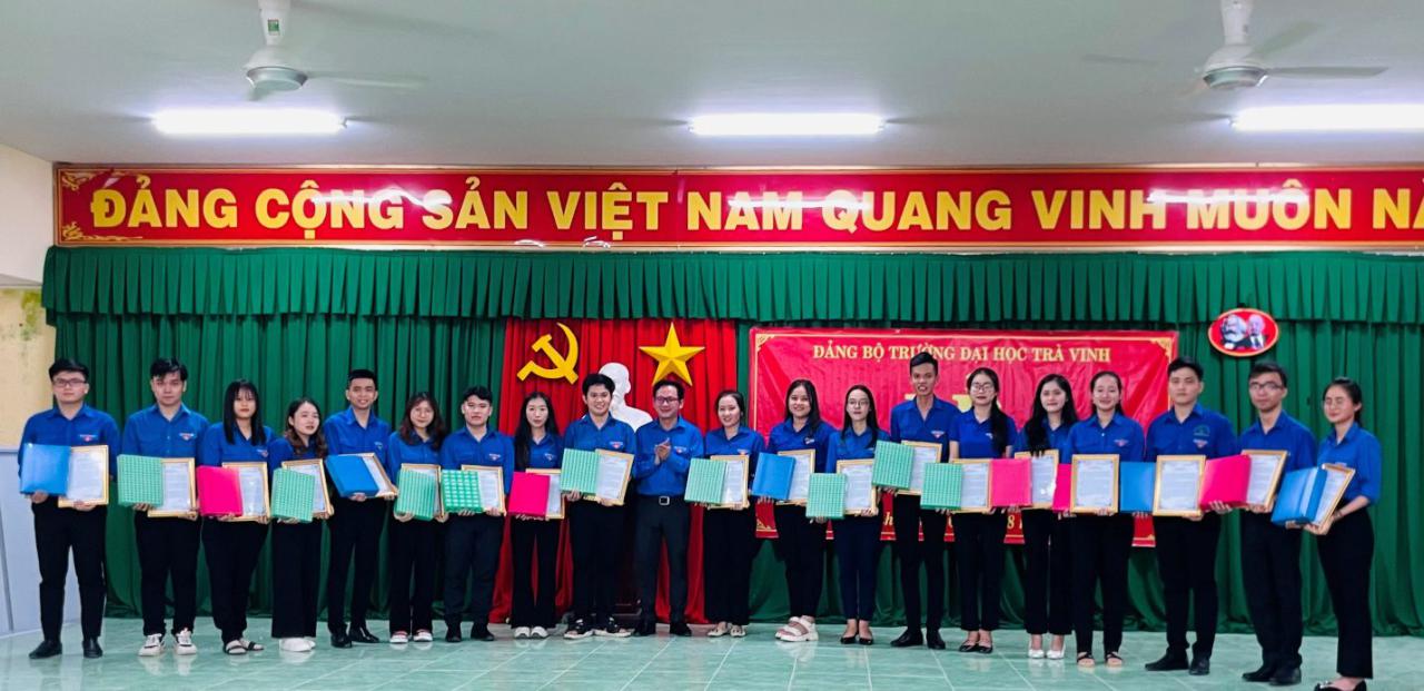 A group of people holding papers Description automatically generated