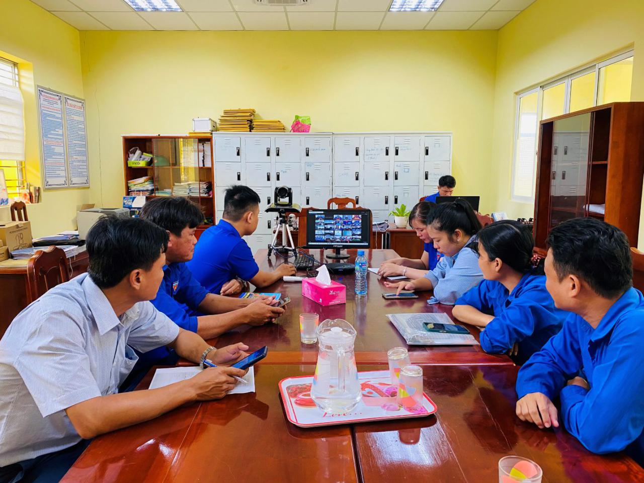 A group of people sitting at a table Description automatically generated