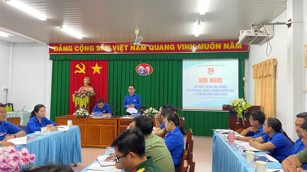 A group of people sitting at a table Description automatically generated