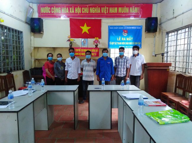 A group of people in a room Description automatically generated with medium confidence