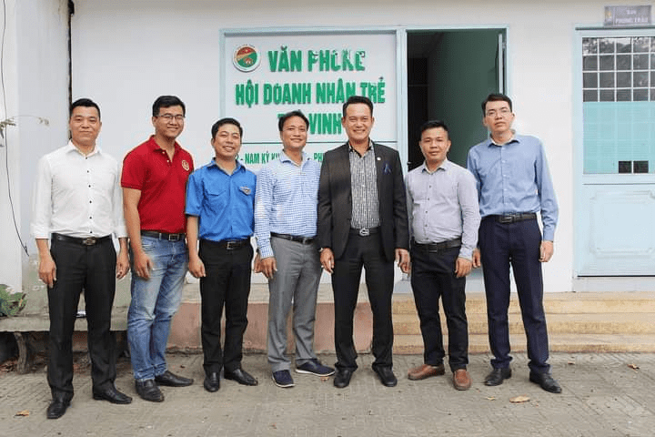 A group of people posing for a photo

Description automatically generated