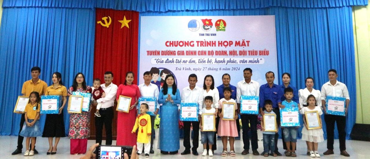 A group of people holding certificates Description automatically generated