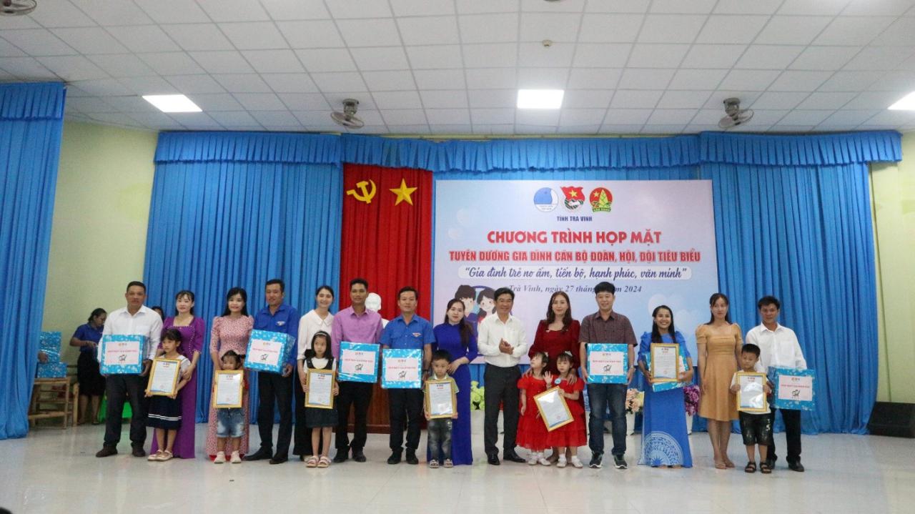 A group of people holding certificates Description automatically generated