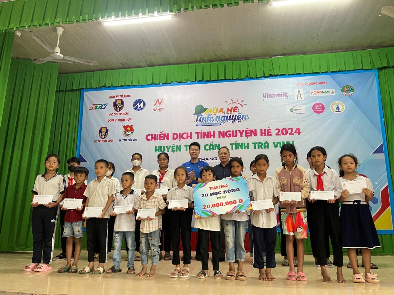 A group of people holding signs Description automatically generated