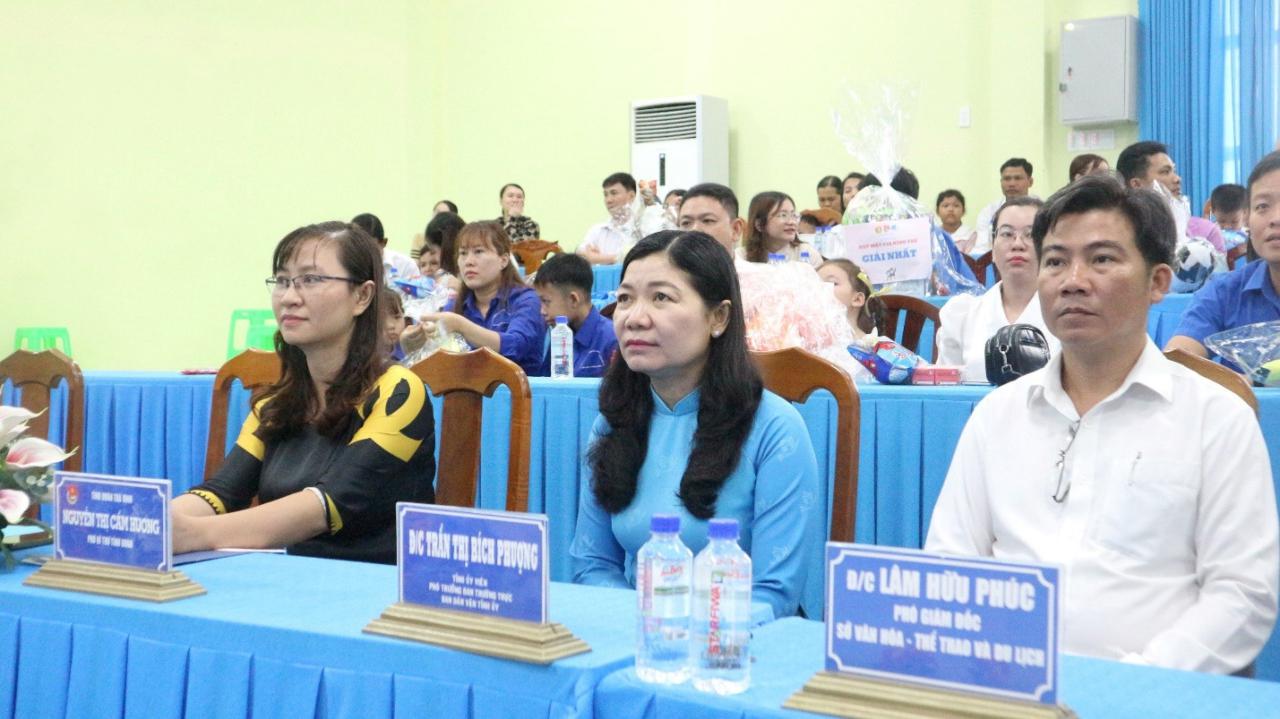 A group of people sitting at a table Description automatically generated