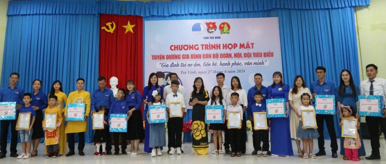 A group of people standing together Description automatically generated