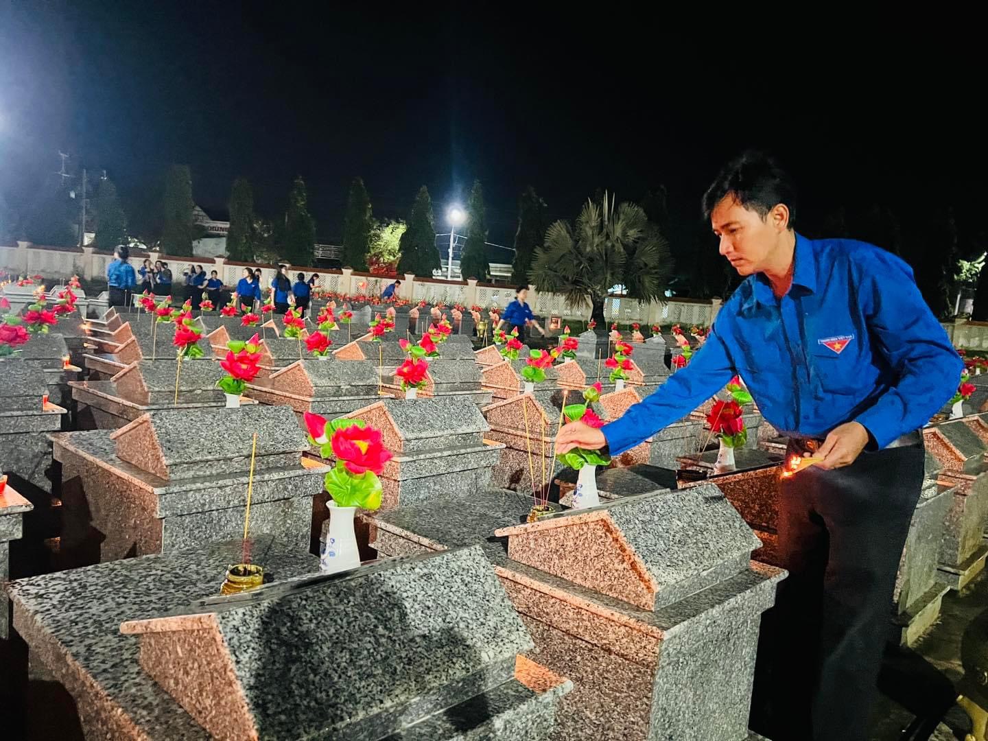 A person sitting on a grave Description automatically generated