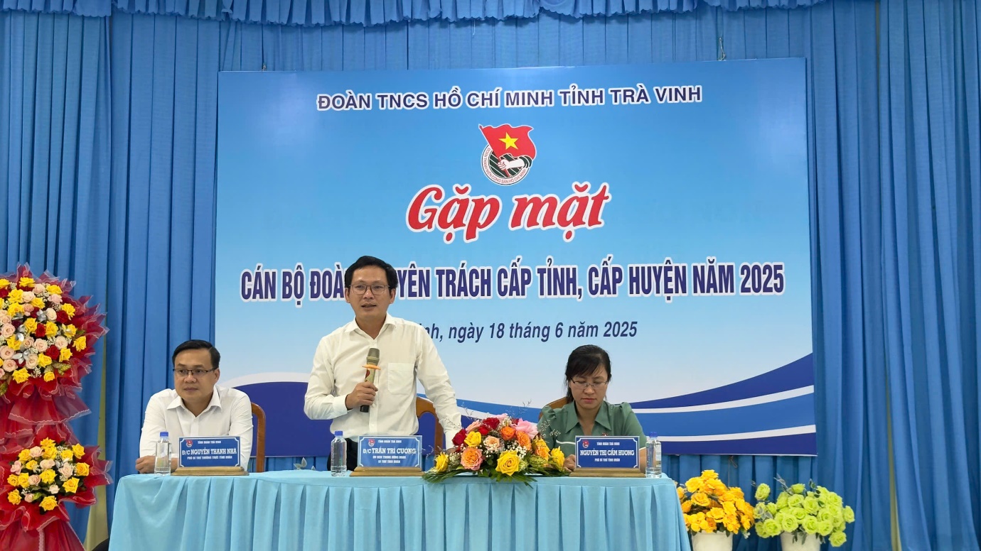 A group of people sitting at a table
Description automatically generated